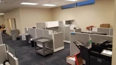 Adma Biologics open office area with cubicles before new flooring