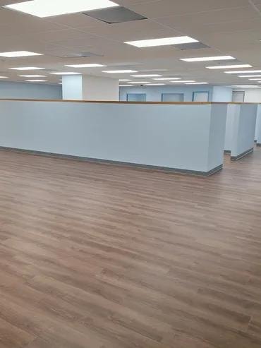 Allapattah Doral Immigration Office open workspace with cubicle dividers and vinyl plank