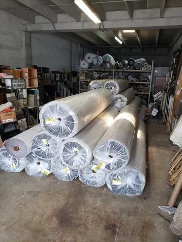 Tequesta Point Condominium carpet rolls in warehouse ready for delivery