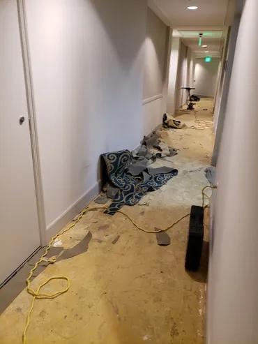 Tequesta Point Condominium hallway during old carpet removal
